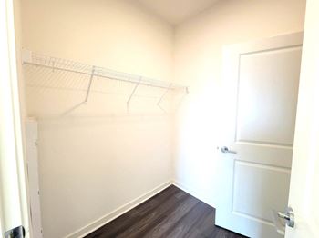 a white closet with a white door and a white wall at Enclave Crystal Lake Townhomes and Apartments, Crystal Lake